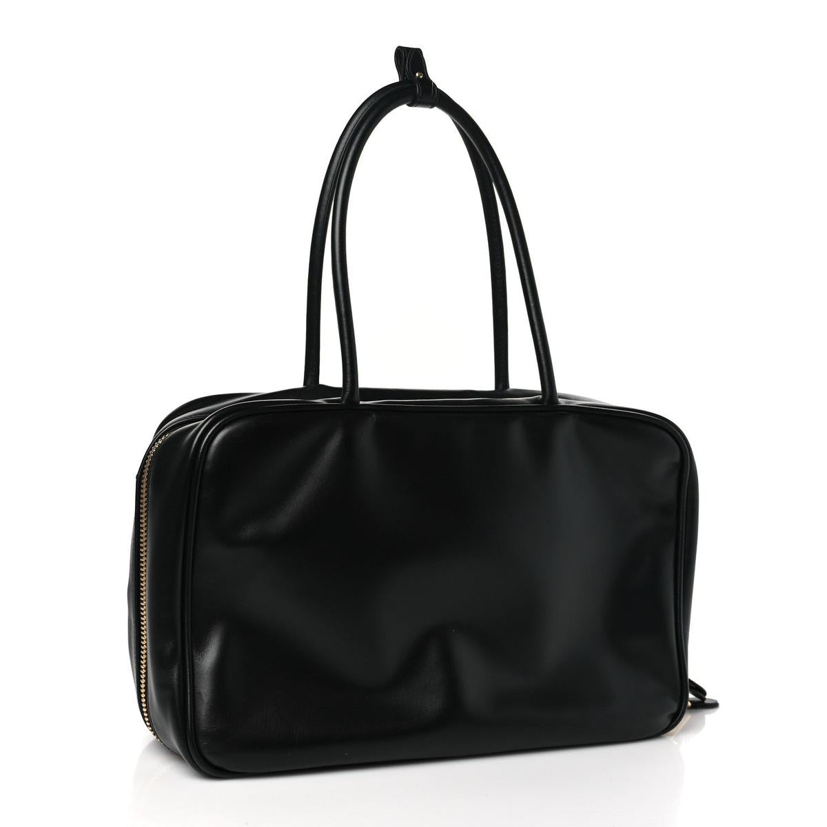 Back 3/4 view showing smooth calfskin body and top handles