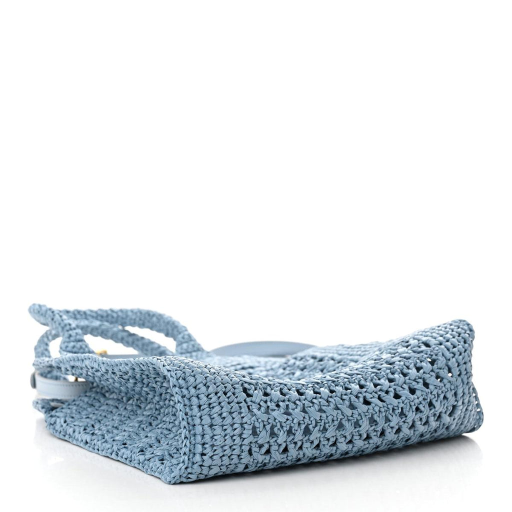 Side view showing woven raffia texture and open crochet weave
