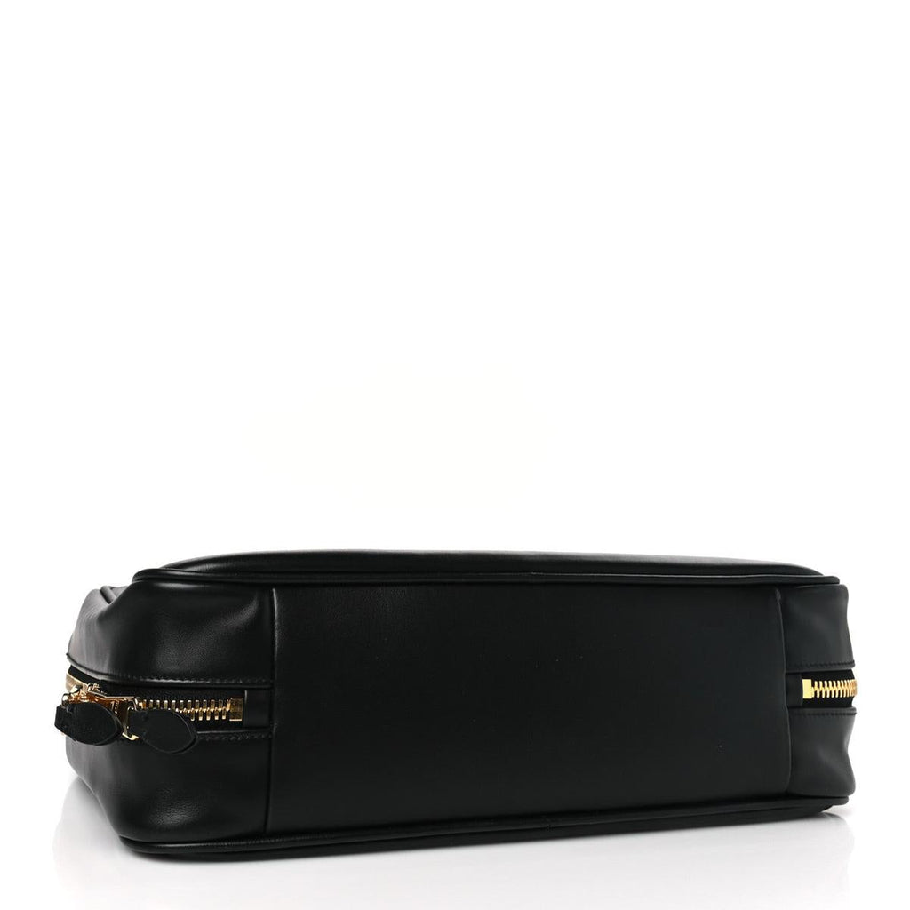 Side view showing gold zipper hardware and leather base