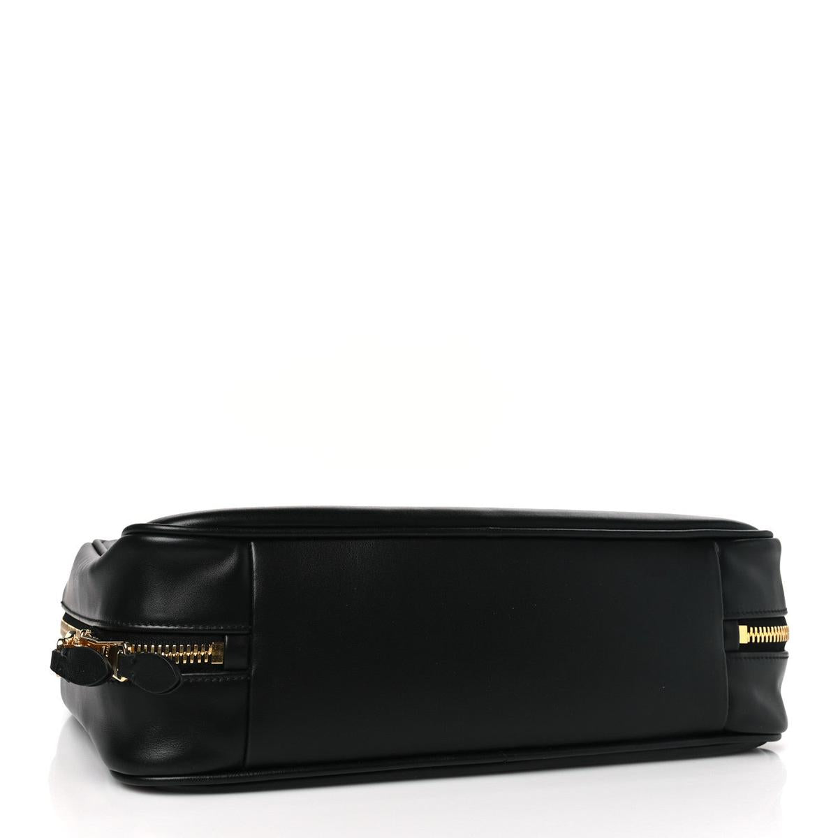 Side view showing gold zipper hardware and leather base