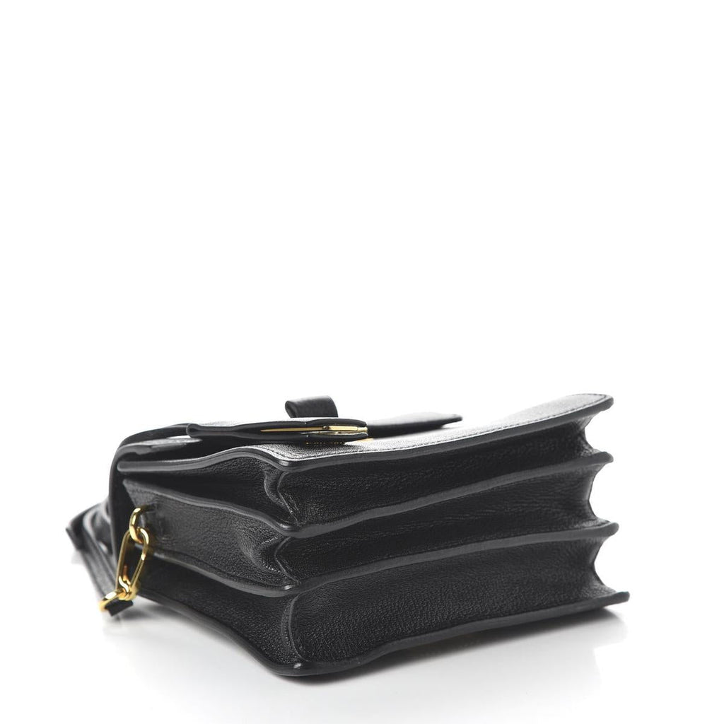 Side view showing goatskin madras texture and hardware