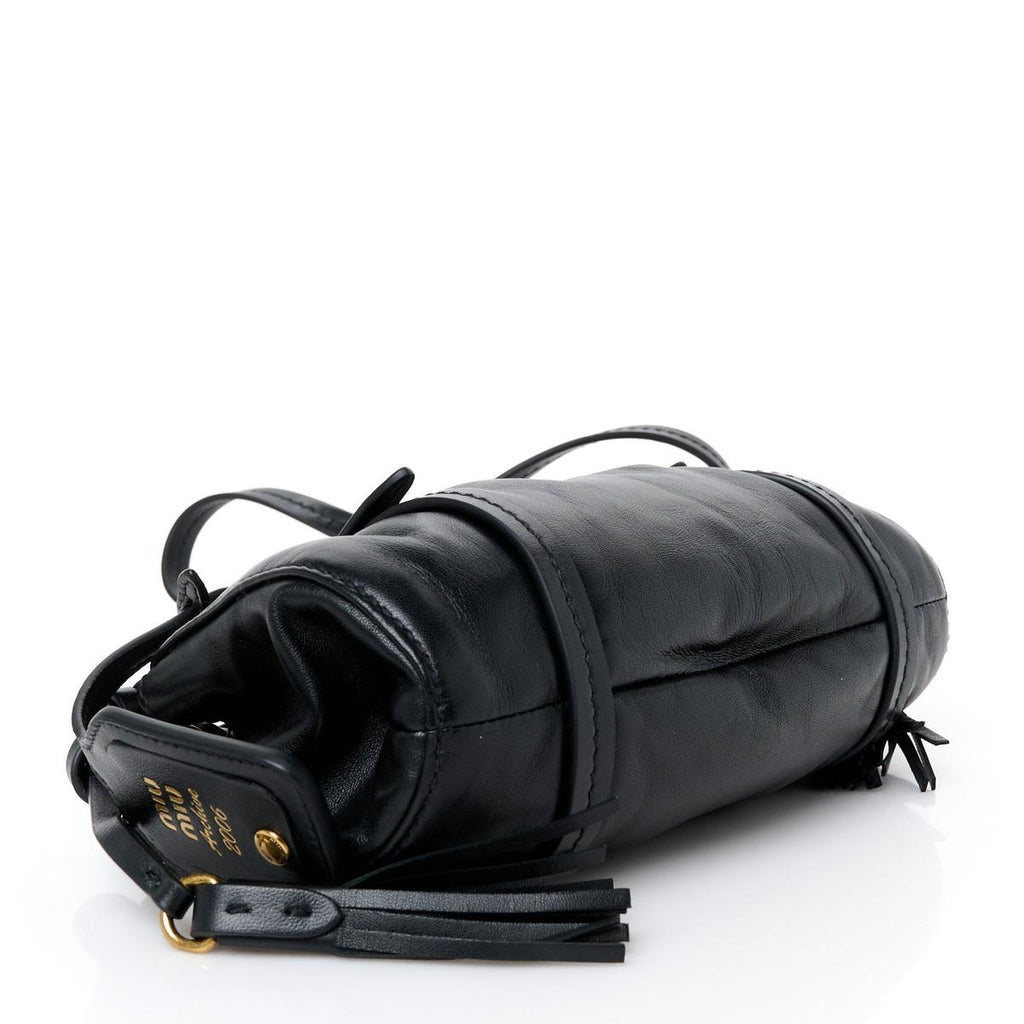 Side view showing black nappa leather body and tassel detail