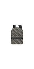 Front view — Dior Men's Safari Backpack in beige and navy blue Dior Oblique jacquard with front zip pocket, padded shoulder straps and 'DIOR' hardware detail