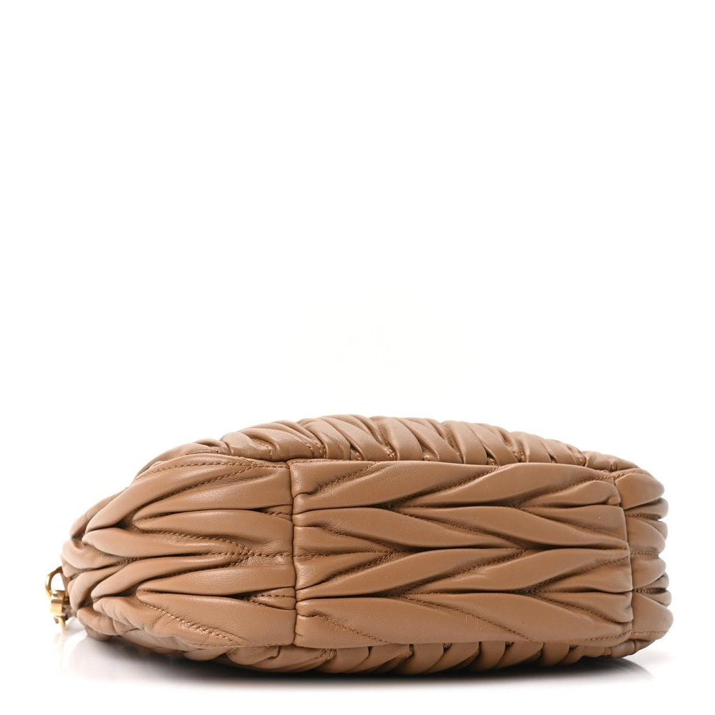 Side view showing caramel matelasse quilted leather texture