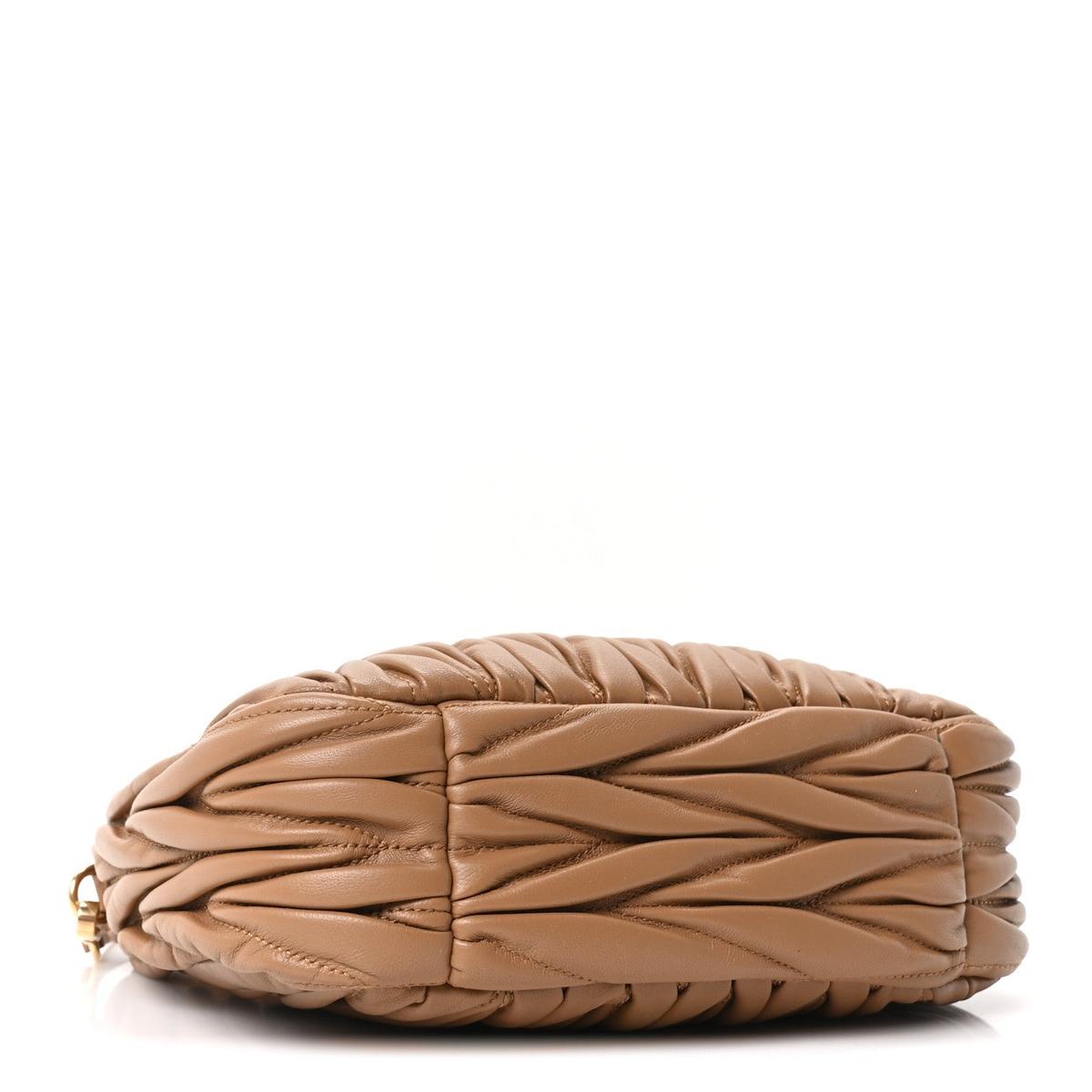 Side view showing caramel matelasse quilted leather texture