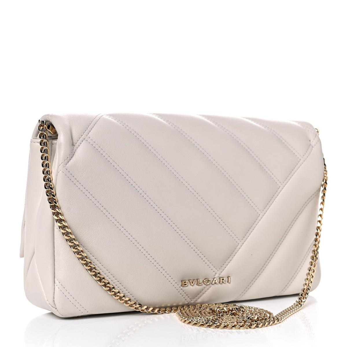 Angled view of Bvlgari Serpenti Cabochon small shoulder bag in white matelasse calfskin