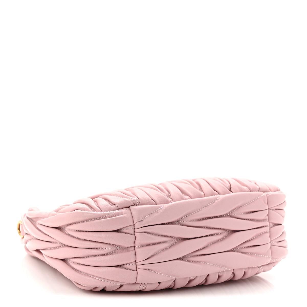 Side view showing matelasse quilted texture and soft leather