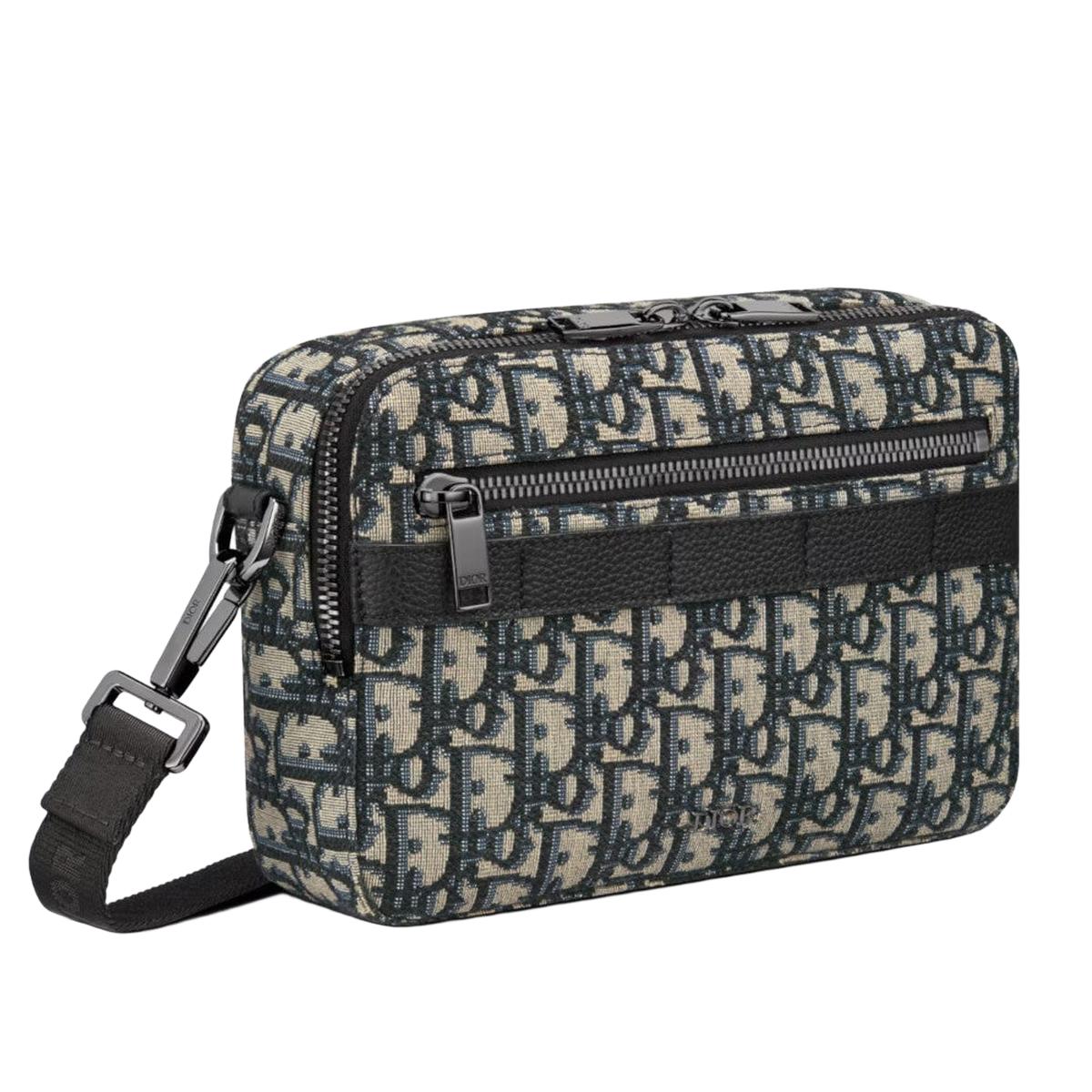 3/4 side view — Dior Men's Safari Messenger Bag in beige and navy blue Dior Oblique jacquard with front zip pockets, silver-tone hardware and adjustable woven 'CHRISTIAN DIOR' shoulder strap