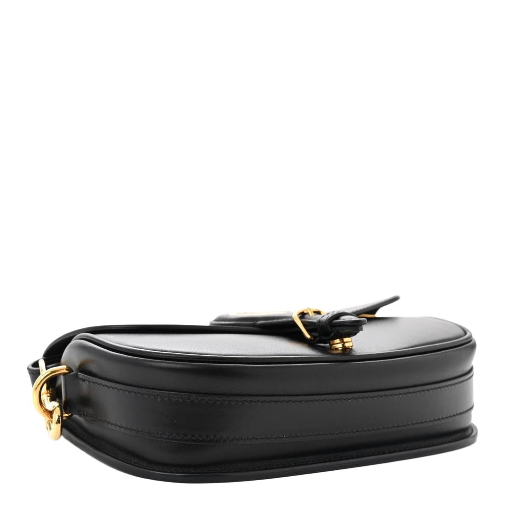 Profile/base view — Dior Bobby East-West Bag in black box calfskin showing structured silhouette and gold-tone D-ring hardware